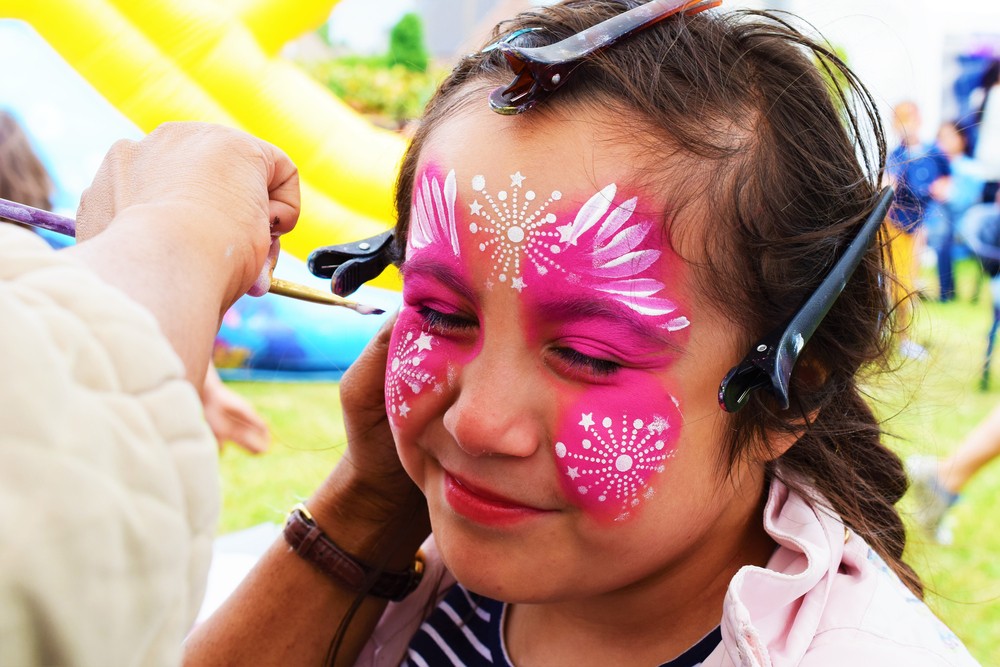 Uncle Chris doing face painting at a party